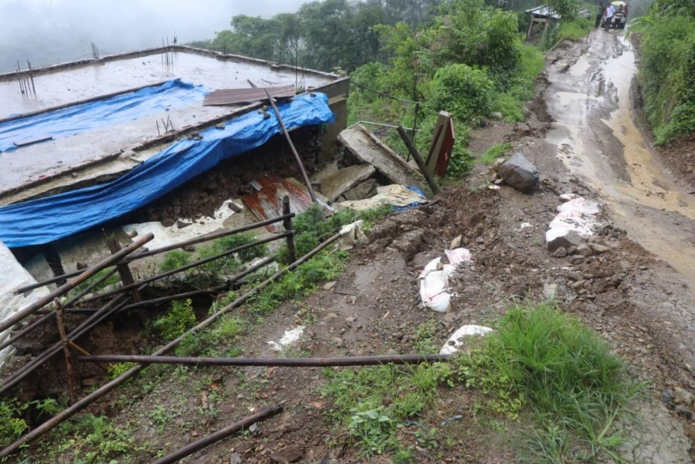 A house affected by land sinking and landslides following ongoing incessant rainfall in Zunheboto.
